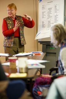 a photo of an OLLI instructor teaching a class