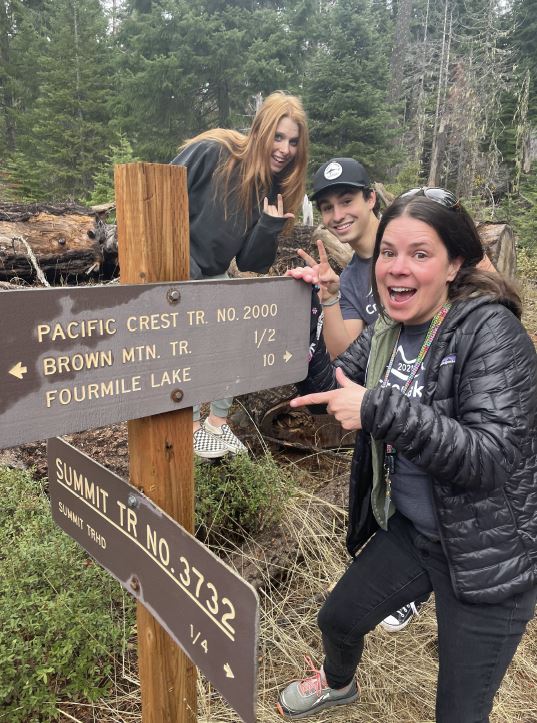 Crater Lake Charter Academy students and teacher at Pacific Crest Trail Marker