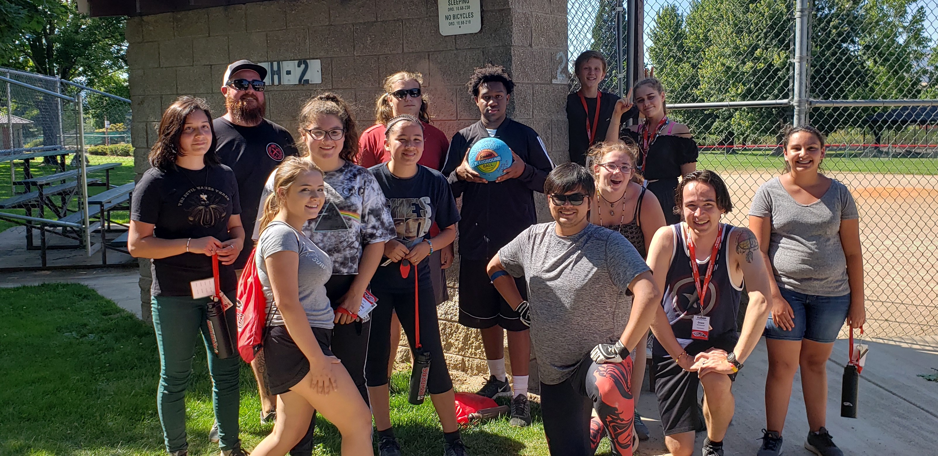 A group of students smiling after playing dodgeball together