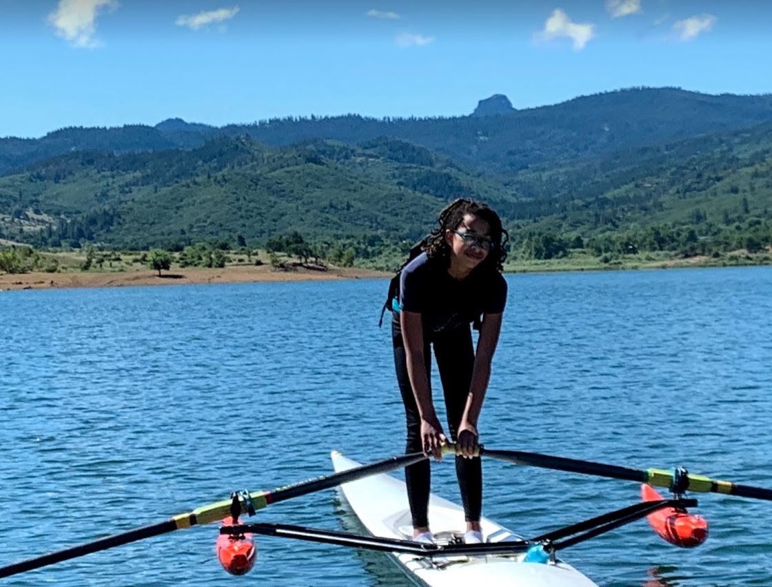 Teenage girl rowing on Emigrant Lake